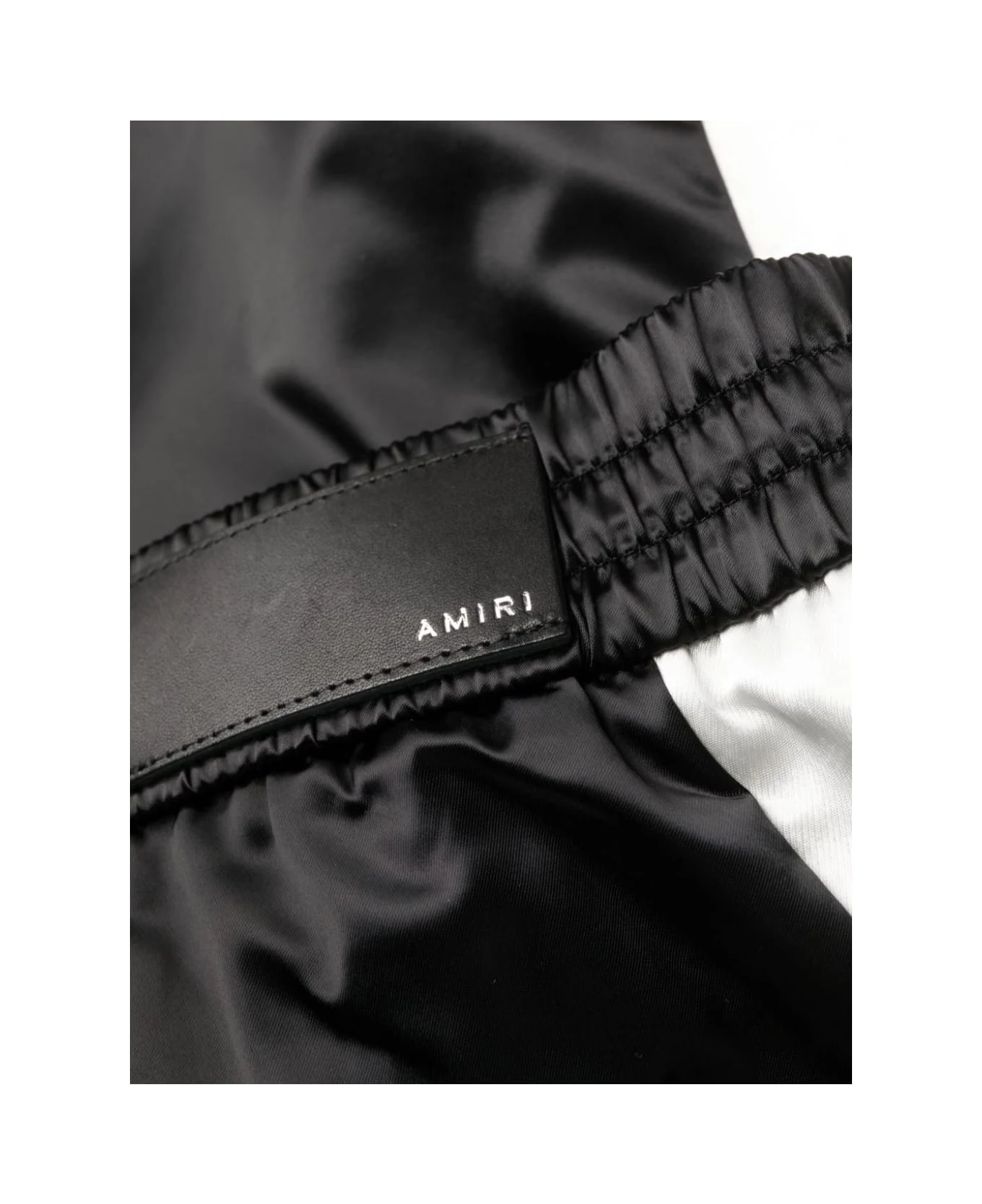 Black Hawaiian Print Track Pants Amiri Black Hawaiian Print Track Pants -Italist Clothing Sale fd4691c3a4c7594a6565c839a13ecf6f